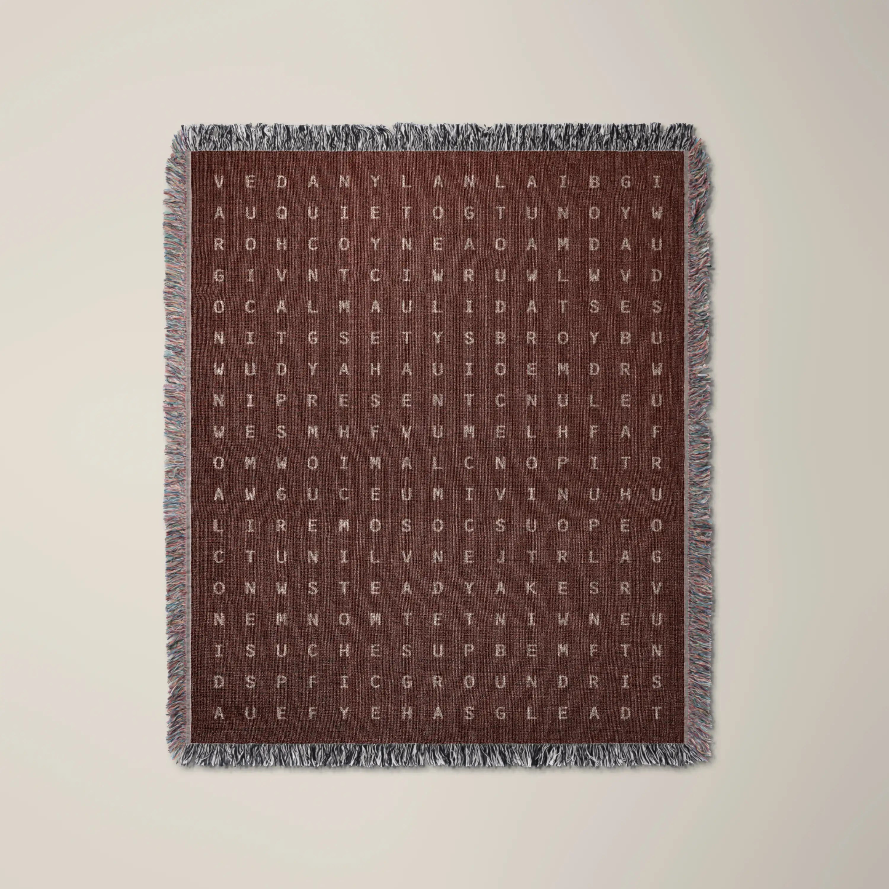 Presence — No. 04 woven blanket in Garnet, a grid of cream letters across olive cotton with words woven into the pattern. #color_garnet