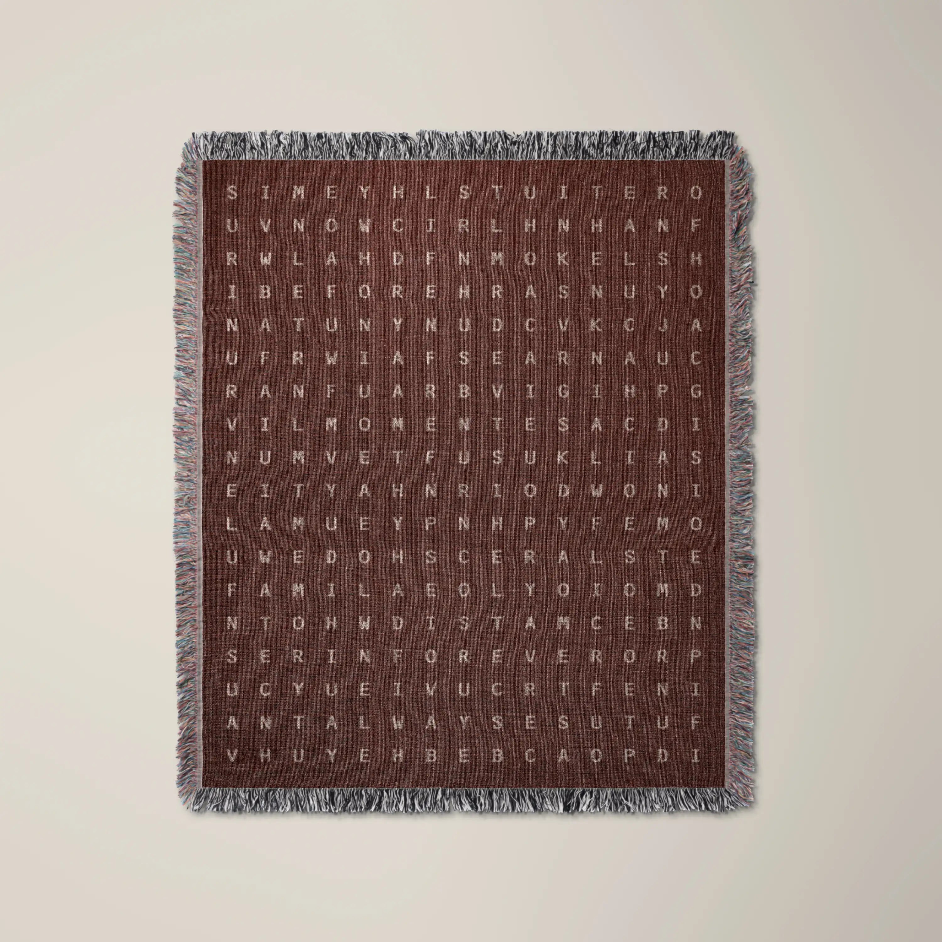 Time — No. 03 woven blanket in Garnet, a grid of cream letters across olive cotton with words woven into the pattern. #color_garnet