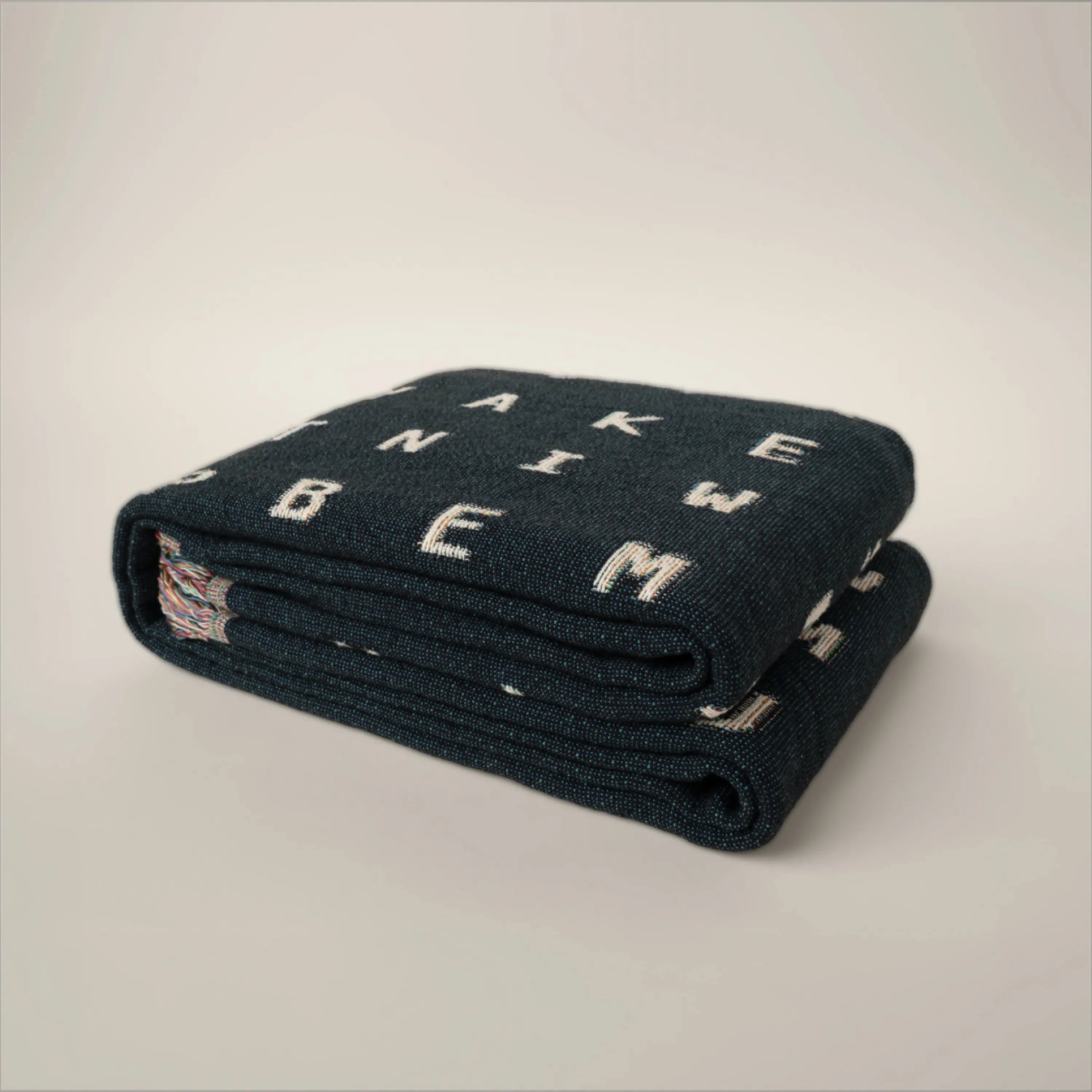 Love — No. 01 in Navy, folded, with partial letters visible across the cotton weave. #color_navy