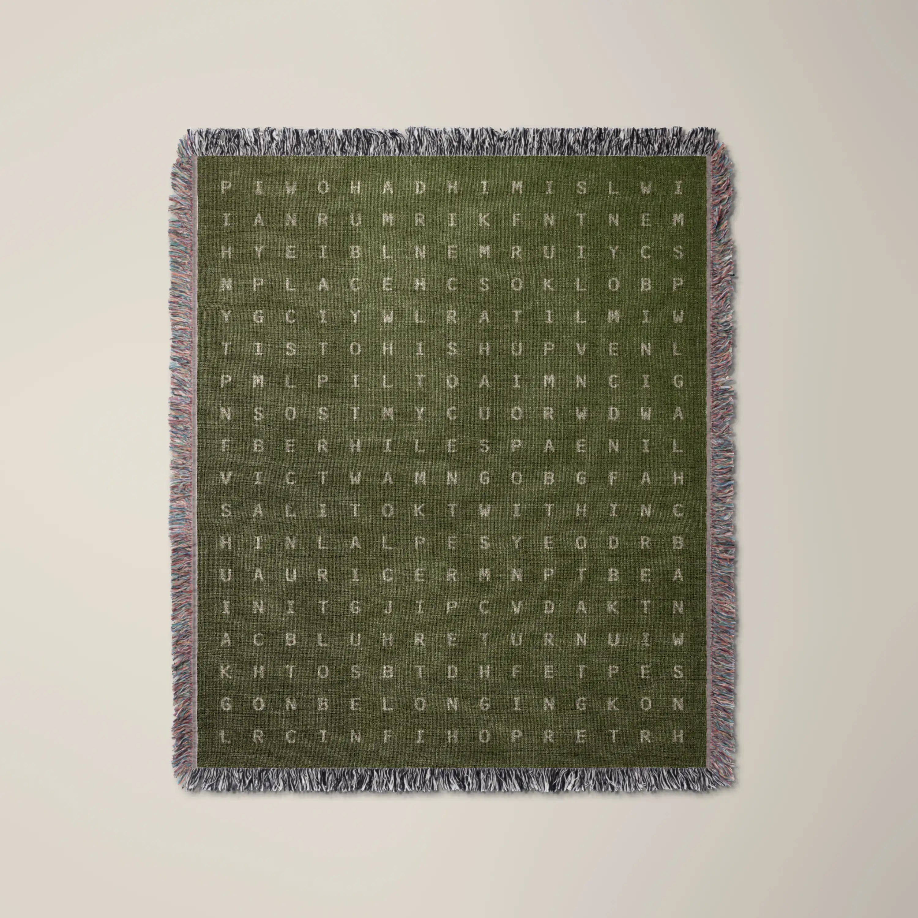 Home — No. 02 woven blanket in Olive, a grid of cream letters across olive cotton with words woven into the pattern. #color_olive