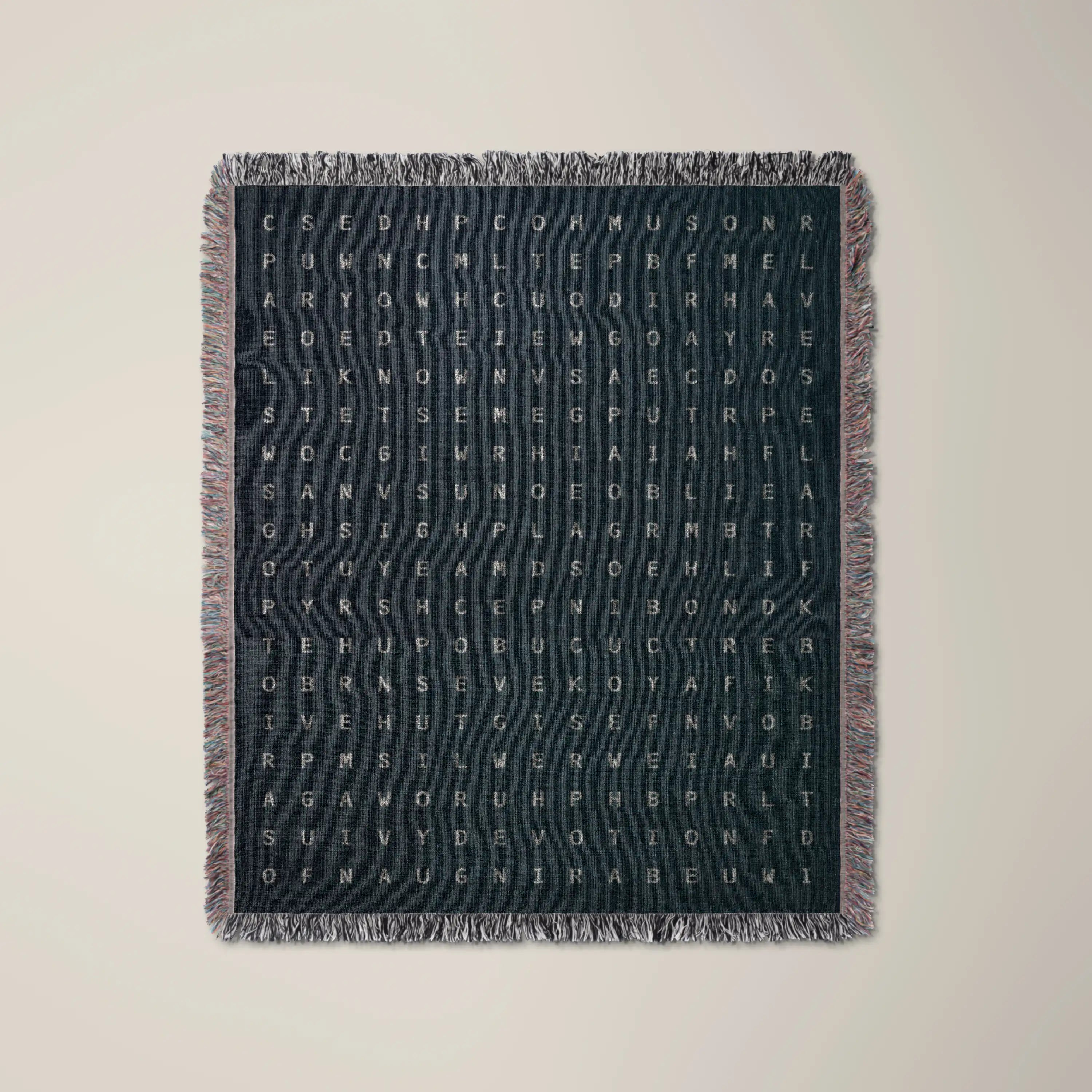 Love — No. 01 woven blanket in Navy, a grid of cream letters across olive cotton with words woven into the pattern. #color_navy