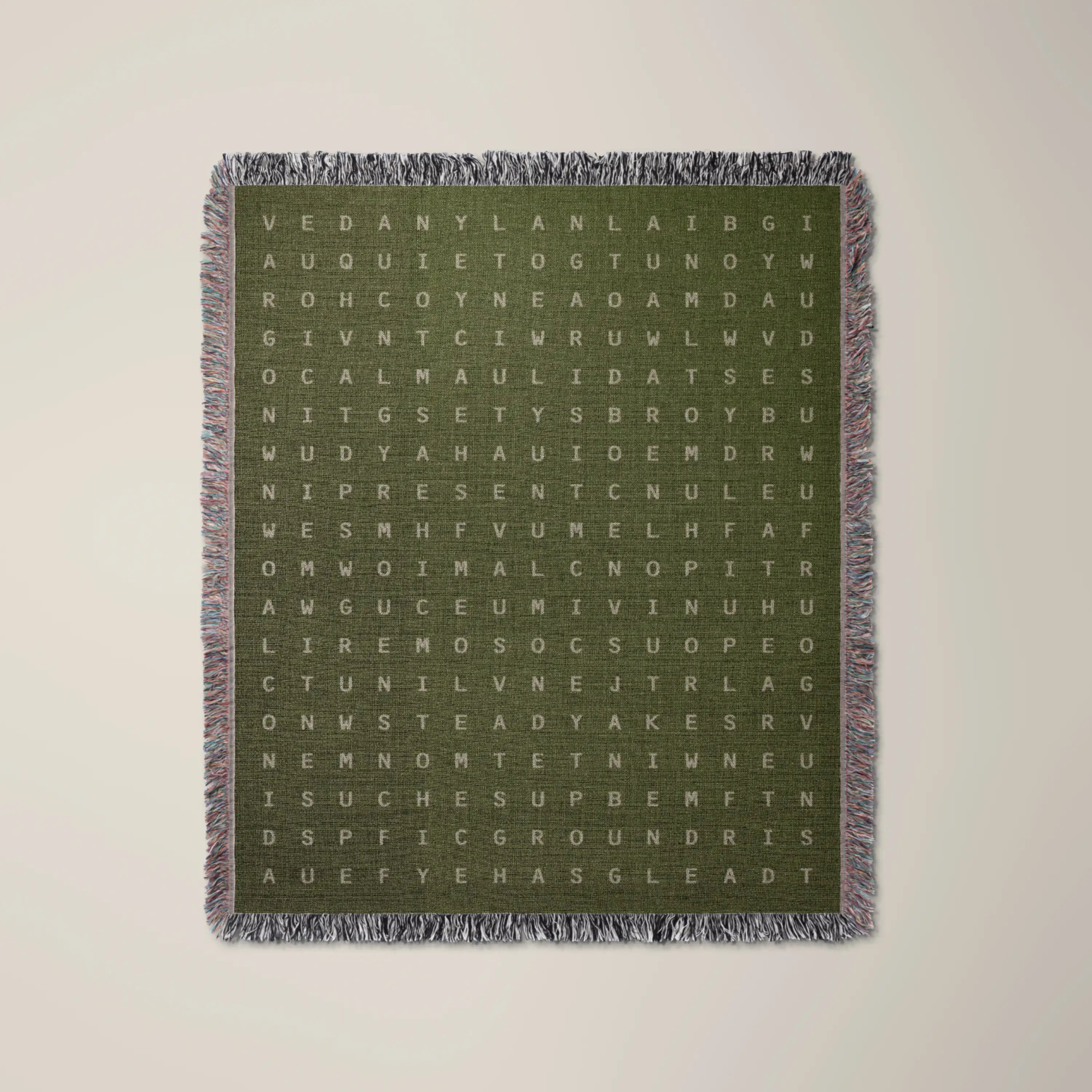 Presence — No. 04 woven blanket in Olive, a grid of cream letters across olive cotton with words woven into the pattern. #color_olive