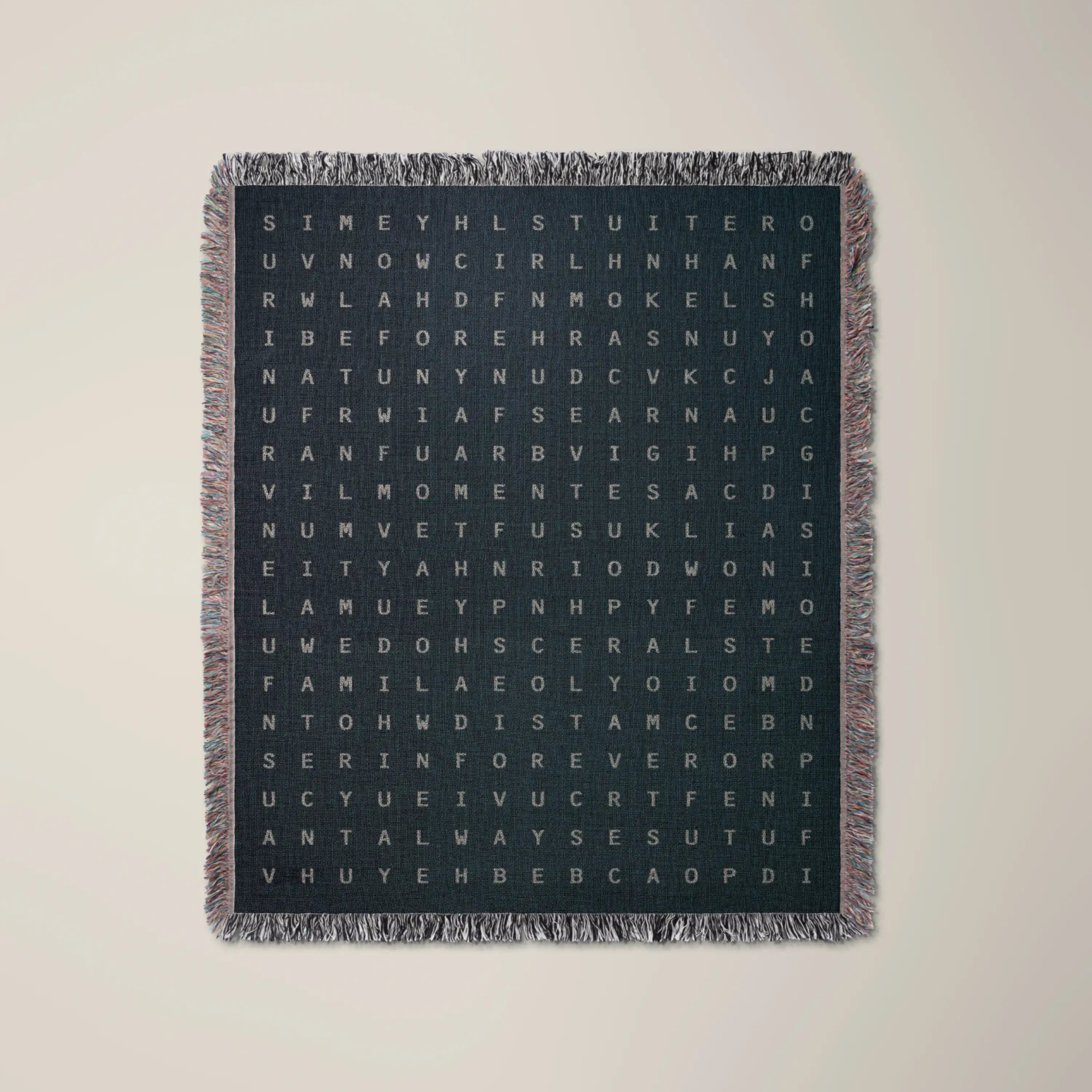 Time — No. 03 woven blanket in Navy, a grid of cream letters across olive cotton with words woven into the pattern. #color_navy
