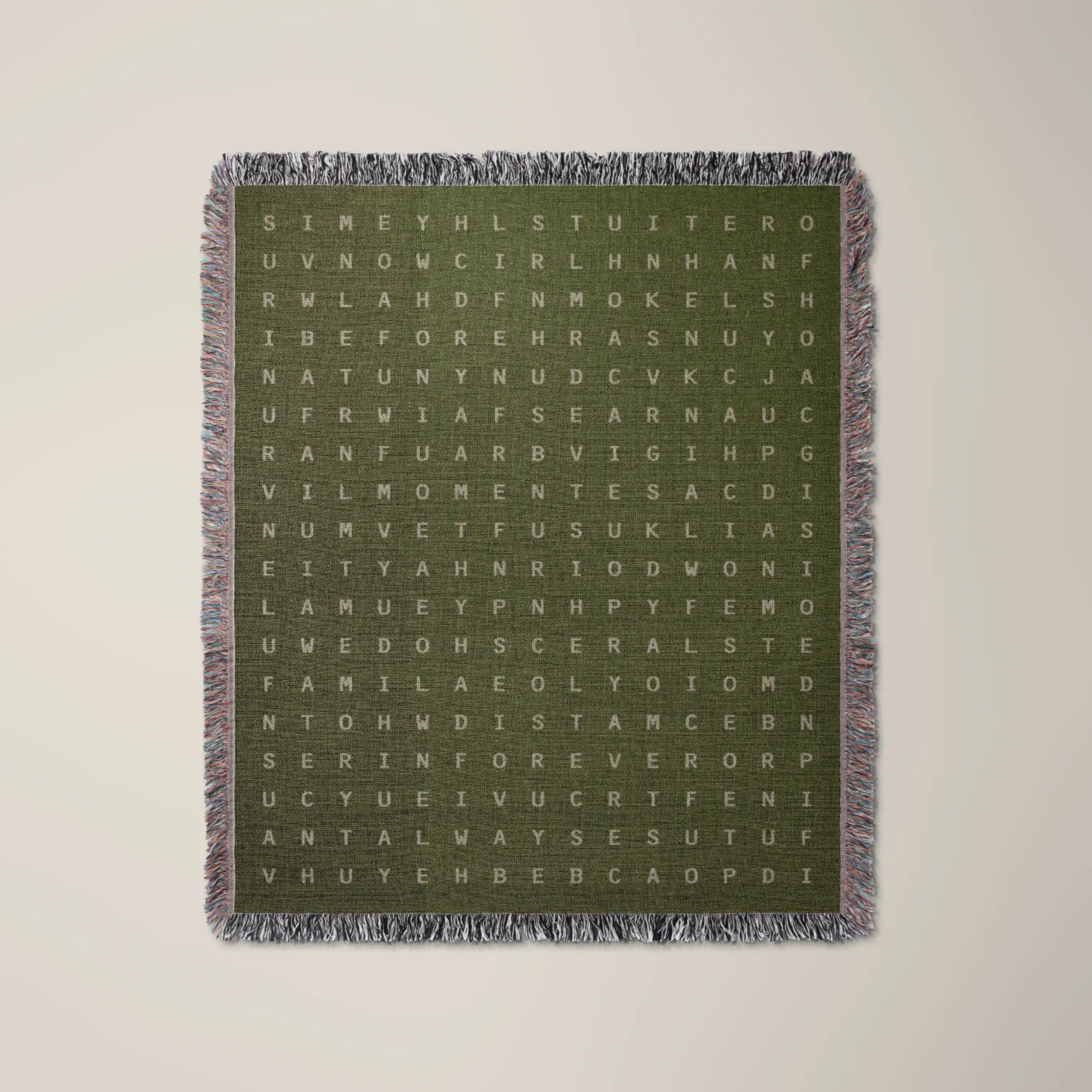 Time — No. 03 woven blanket in Olive, a grid of cream letters across olive cotton with words woven into the pattern. #color_olive