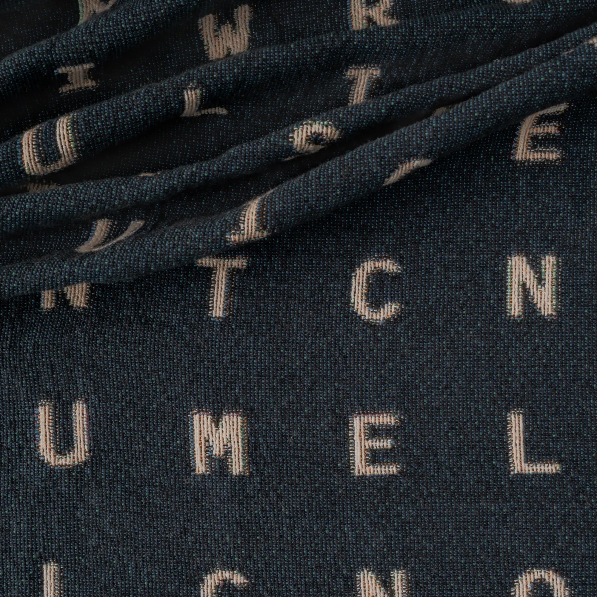 Love — No. 01 in Navy, draped, with partial letters visible across the cotton weave. #color_navy